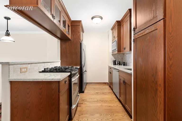 New York City Real Estate | View 330 Third Avenue, 8H | Open Kitchen with Bar Stool Seating  | View 2