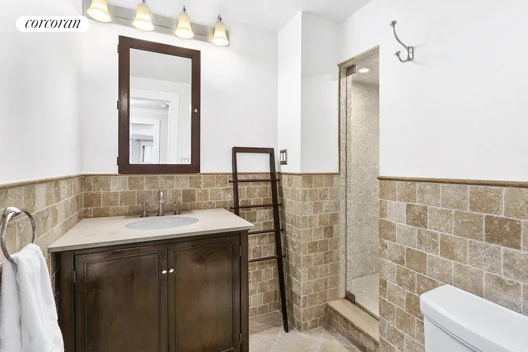 New York City Real Estate | View 225 East 57th Street, 8F | Renovated 2nd Bathroom w/ Large Walk-In Shower | View 4