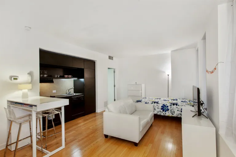 New York City Real Estate | View 56 Pine Street, 7E | Living Room with enough space for all | View 3