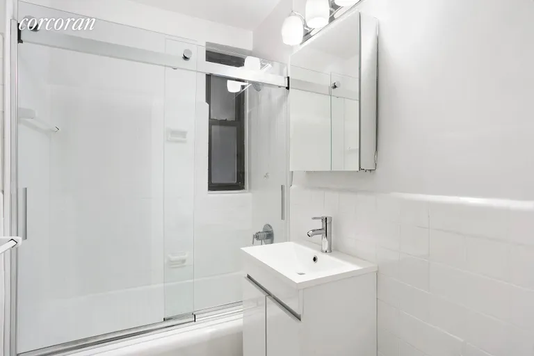 New York City Real Estate | View 60 East 9th Street, 232 | Windowed Renovated Bathroom | View 6