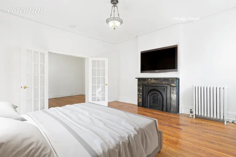 New York City Real Estate | View 331 West 19th Street, 3 | Master bedroom with decorative fireplace | View 5