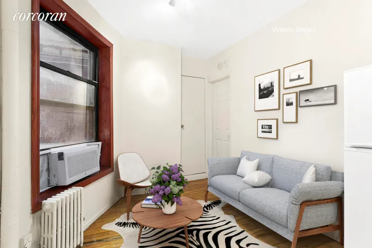 New York City Real Estate | View 242 East 10th Street, 1 | Living room (virtually staged) facing bedroom | View 2
