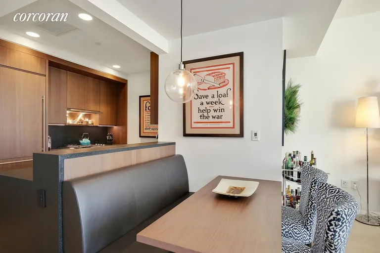 New York City Real Estate | View 50 West Street, 10B | Kitchen/Dining Room w/ Built In Banquet | View 2
