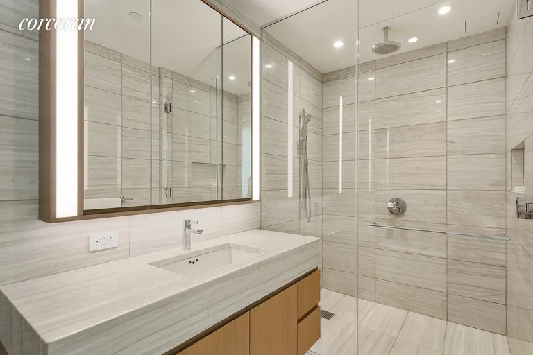 New York City Real Estate | View 50 West Street, 10B | Marble Bathroom | View 6