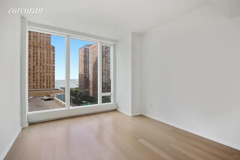 New York City Real Estate | View 50 West Street, 10B | Bedroom w/ Floor to Ceiling Windows | View 5