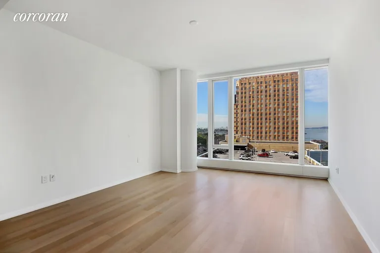 New York City Real Estate | View 50 West Street, 10B | Living Room w/ Floor to Ceiling Windows | View 4