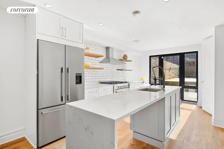 New York City Real Estate | View 70A Somers Street | Custom kitchen with waterfall countertop! | View 3