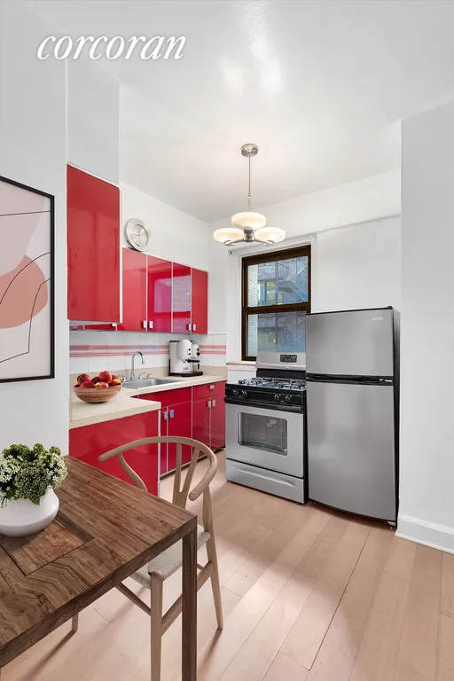 New York City Real Estate | View 135 West 16th Street, 21 | Windowed eat-in kitchen (virtually staged) | View 2