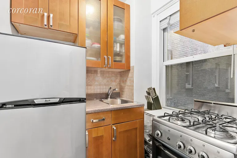 New York City Real Estate | View 321 East 43rd Street, 515 | 3 Kitchen w/Window | View 3