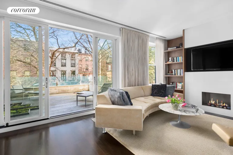 New York City Real Estate | View 16 Sidney Place | Third floor Den with fireplace and terrace | View 6
