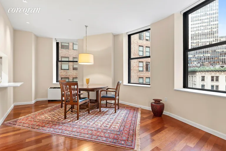 New York City Real Estate | View 1 Wall Street Court, 1105 | Convex wall of ten over-sized windows | View 2