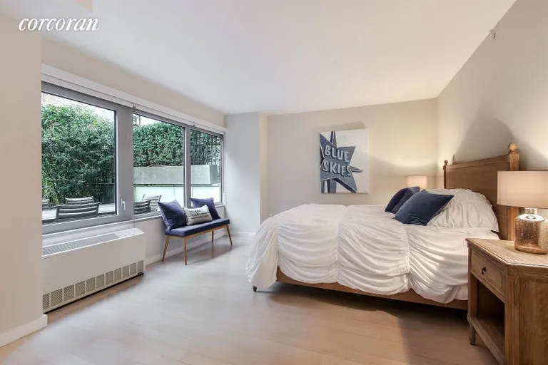 New York City Real Estate | View 447 West 18th Street, GD1 | Master Bedroom overlooking Outdoor Space | View 5