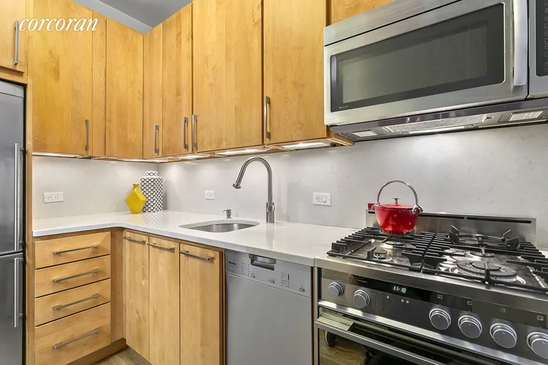 New York City Real Estate | View 225 West 25th Street, 2J | Luxury Finishes and Appliances in Separate Kitchen | View 3