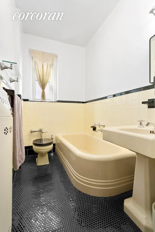 New York City Real Estate | View 140 8th Avenue, 5F | Charming pre-war bath with new black pebble tile | View 6