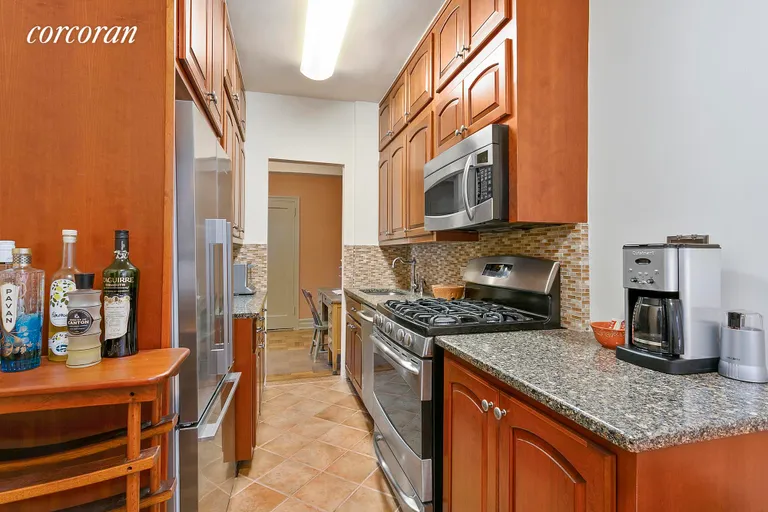 New York City Real Estate | View 140 8th Avenue, 5F | Renovated galley kitchen with dining area | View 4