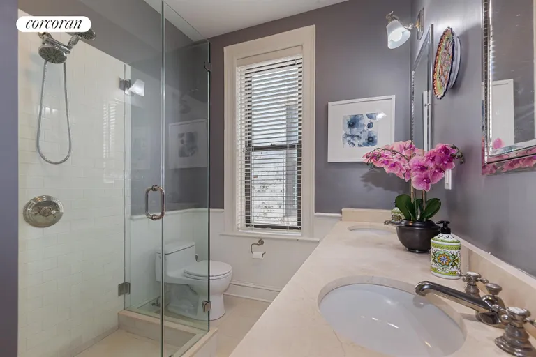 New York City Real Estate | View 164 Prospect Park West, 4L | Crisp bathroom also has a washer/dryer | View 7