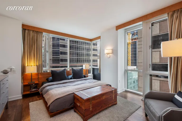 New York City Real Estate | View 60 East 55th Street, 28A | Corner bedroom with custom built-ins | View 4