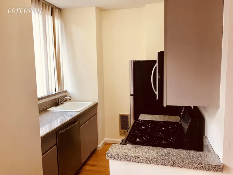 New York City Real Estate | View 304 East 65th Street, 10B | Windowed Kitchen | View 2
