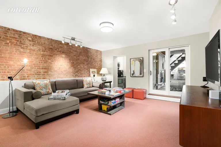 New York City Real Estate | View 50 Hamilton Terrace | Media Room with Back Yard Access | View 26