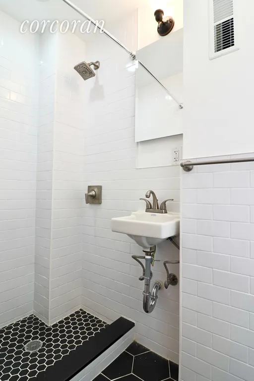 New York City Real Estate | View 125 West 72nd Street, PH | Renovated bathroom with a window | View 8