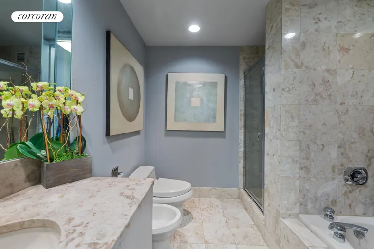 New York City Real Estate | View 100 United Nations Plaza, 40C | Ensuite Master Bathroom w/ Jacuzzi & Stall Shower | View 6