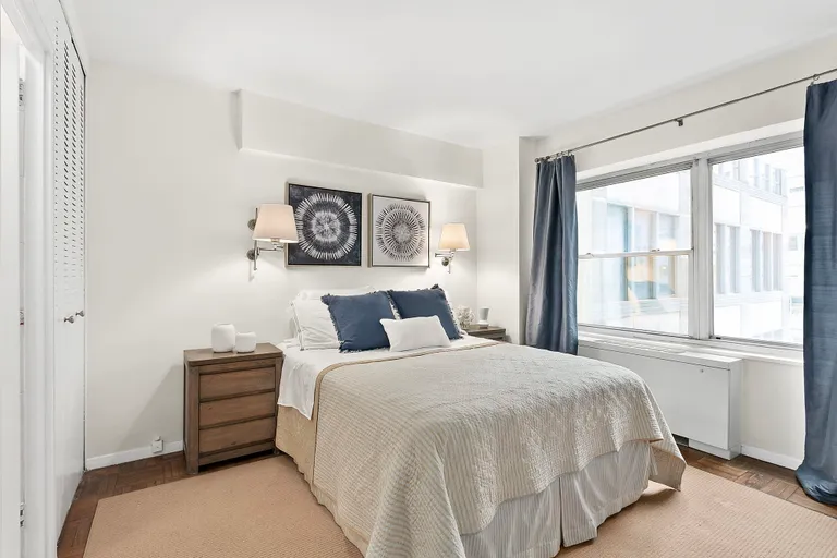New York City Real Estate | View 118 East 60th Street, 12F | Bedroom with wall-to-wall window | View 3