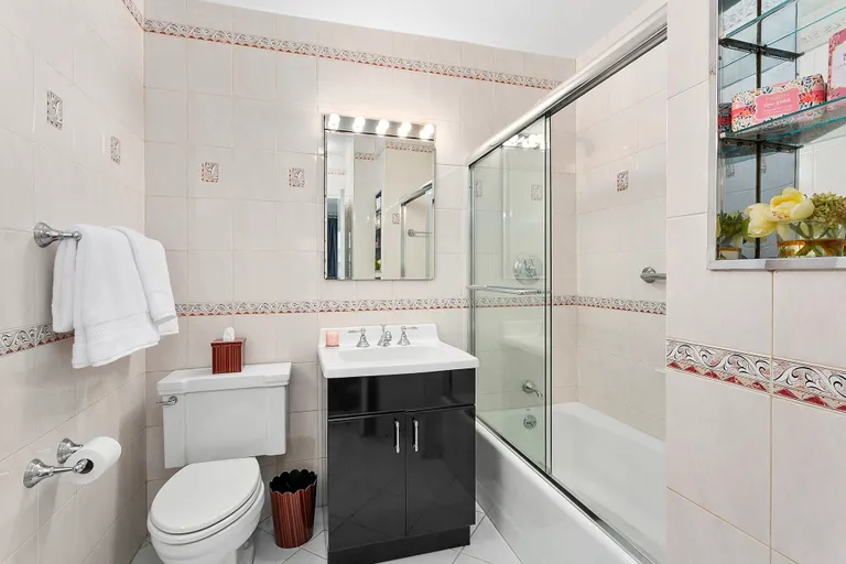 New York City Real Estate | View 118 East 60th Street, 12F | Large, renovated bathroom  | View 5