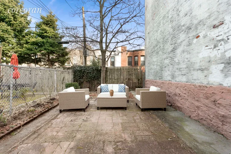 New York City Real Estate | View 45 Fuller Place | Spacious and sunny backyard w/lovely tree! | View 7