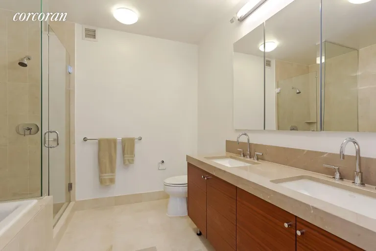 New York City Real Estate | View 30 West Street, 19G | Marble Master Bathroom | View 4