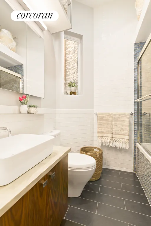 New York City Real Estate | View 246 5th Avenue, 1L | Full Bathroom with Washer | Dryer | View 9