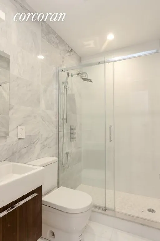 New York City Real Estate | View 211 8th Avenue, 1B | Carrera Marble Bathroom | View 5