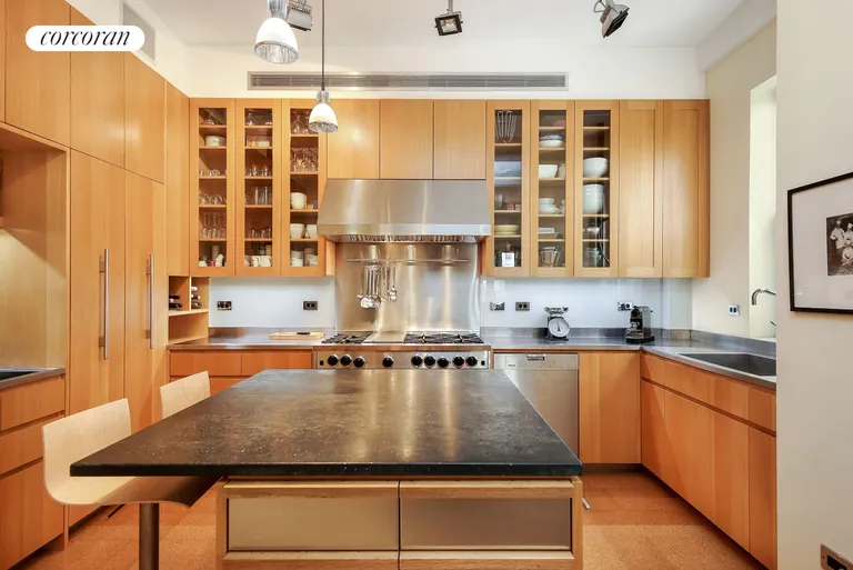 New York City Real Estate | View 302 West 86th Street, 10B | Windowed chef's kitchen with custom cabinetry | View 4