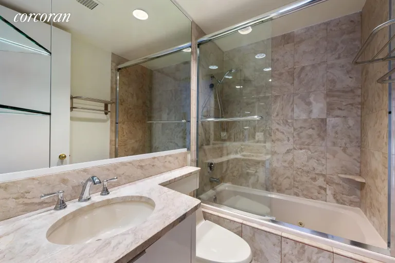 New York City Real Estate | View 100 United Nations Plaza, 8F | Ensuite Marble Bathroom | View 4