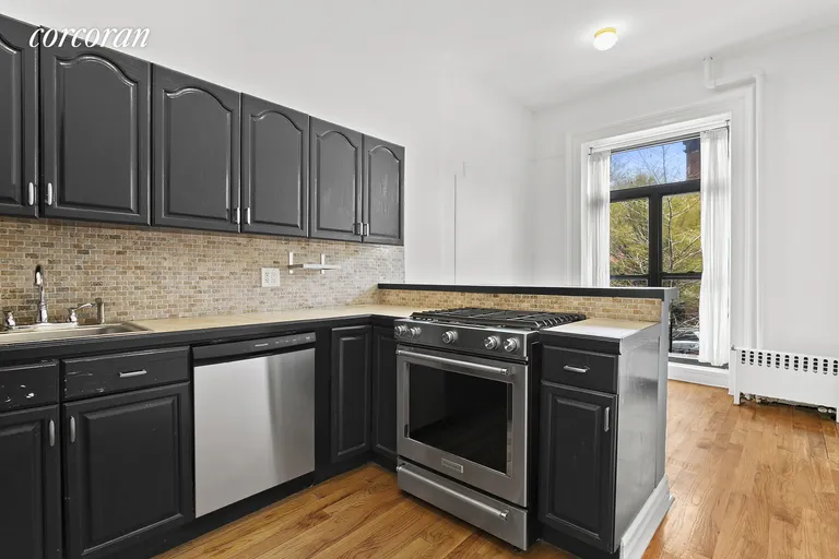 New York City Real Estate | View 294 Saint James Place, 1 | New appliances & breakfast bar | View 2