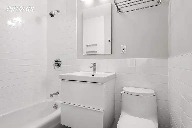 New York City Real Estate | View 67 East 11th Street, 723 | Mint White Tile Bathroom | View 4