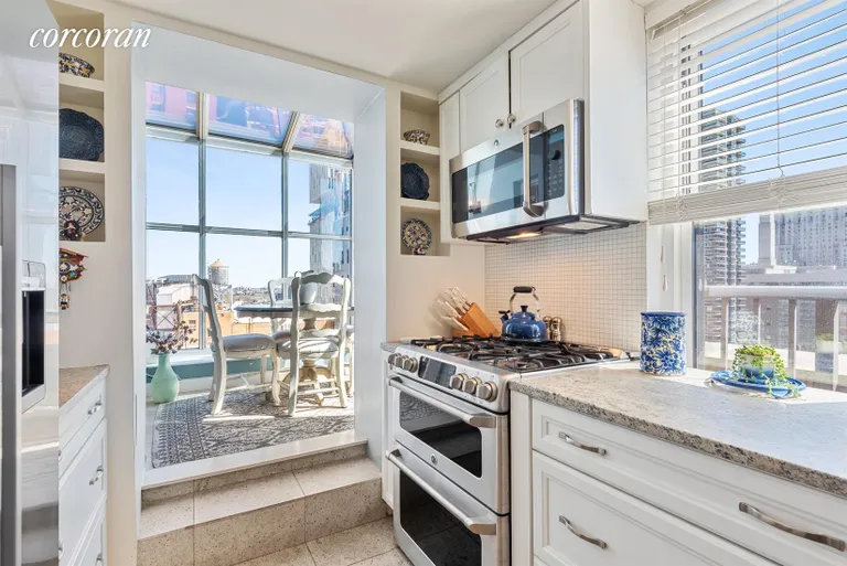 New York City Real Estate | View 444 East 75th Street, 20C | Kitchen & Solarium | View 4