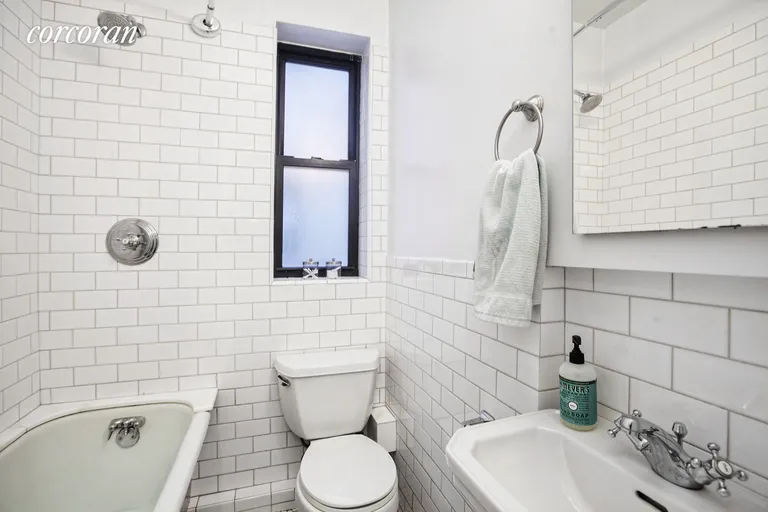 New York City Real Estate | View 137 West 12th Street, 2-3 | Windowed bathroom with subway tiles | View 5