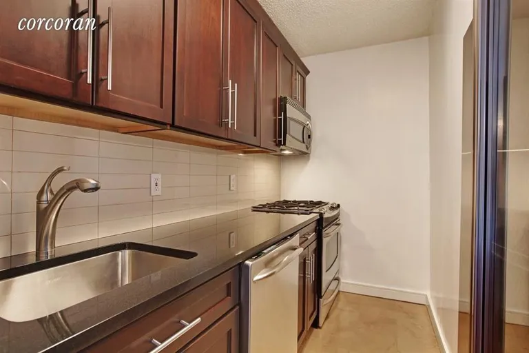 New York City Real Estate | View 347 West 57th Street, 24B | Granite countertop, Stainless steel appliances  | View 3
