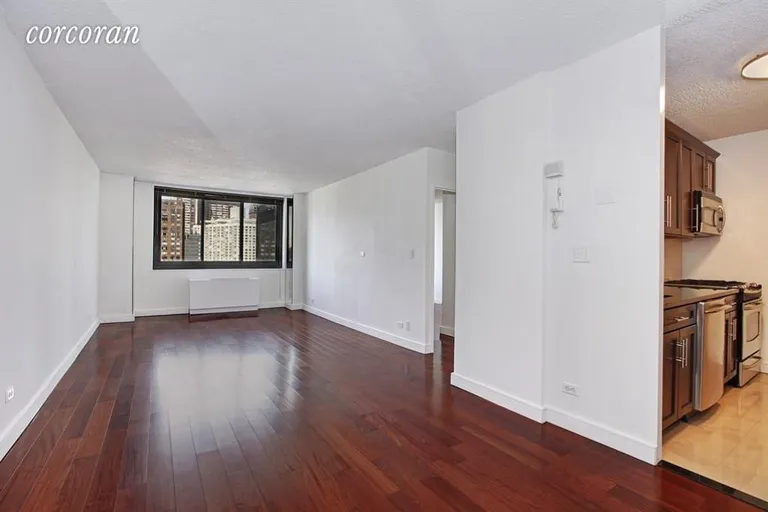 New York City Real Estate | View 347 West 57th Street, 24B | 28 feet  living room can easily have office/dining | View 4