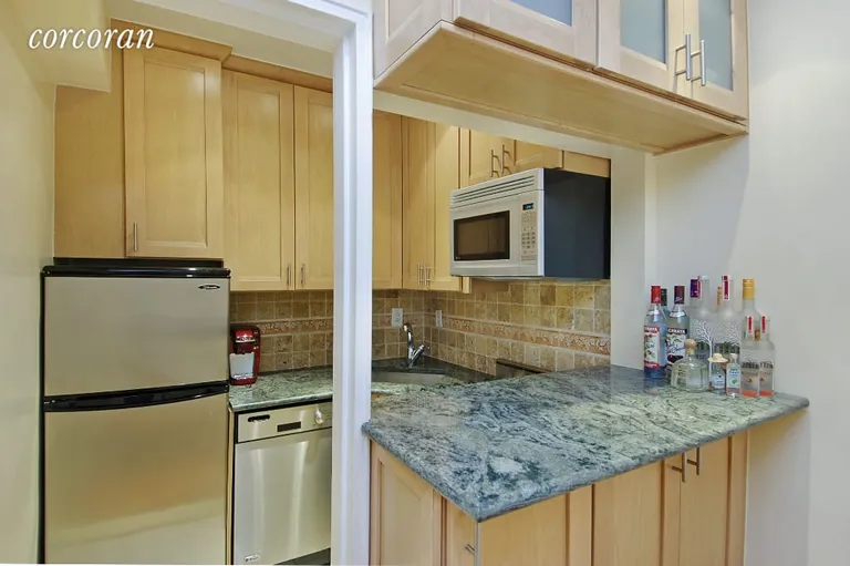New York City Real Estate | View 30 East 9th Street, 6GG | Open Kitchen with Breakfast bar | View 2