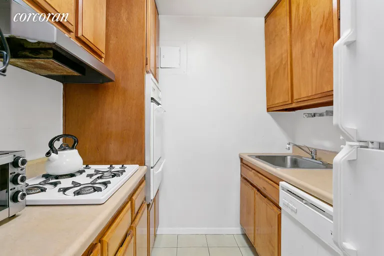 New York City Real Estate | View 7 East 14th Street, 328 | Kitchen with separate range & oven and dishwasher | View 6