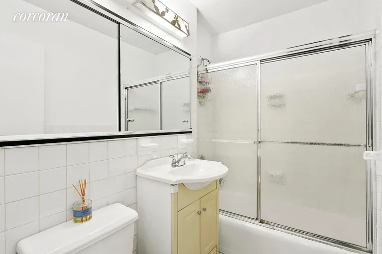 New York City Real Estate | View 7 East 14th Street, 328 | Shower/tub combo and full medicine cabinet | View 5