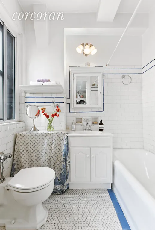 New York City Real Estate | View 457 West 57th Street, 1705 | Windowed bathroom w lovely tile details | View 6