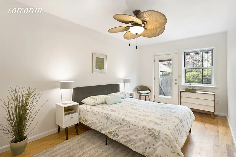 New York City Real Estate | View 338 58th Street, 1 | Master bedroom and bath, leading to yard | View 5