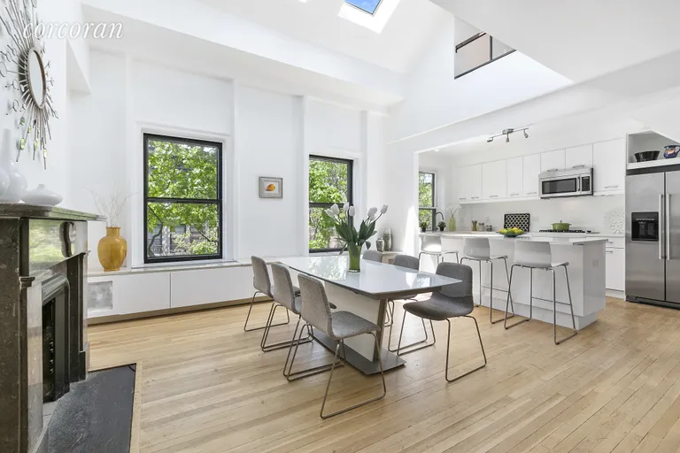 New York City Real Estate | View 9 Garden Place, 2 | Dining room and kitchen with 16.7 ft ceilings | View 2