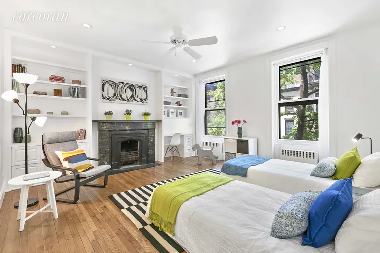 New York City Real Estate | View 9 Garden Place, 2 | Huge bedroom with built in shelves and fireplace | View 11