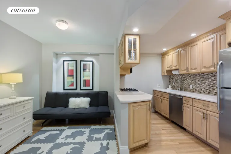 New York City Real Estate | View 225 East 57th Street, 9G | Kitchen and Den/Playroom | View 2