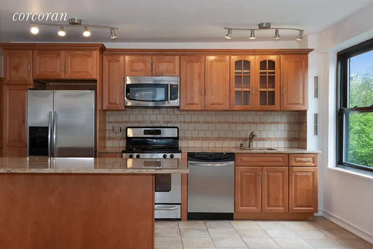 New York City Real Estate | View 210 East Broadway, H504 | Open Kitchen with Granite Countertops  | View 3