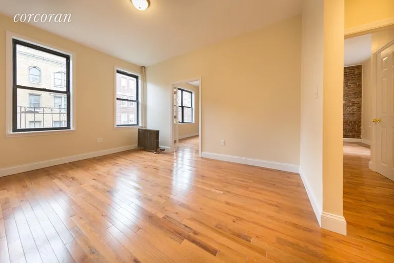 New York City Real Estate | View 608 West 188th Street, 42 | Spacious Living Room with Oversized Windows | View 8