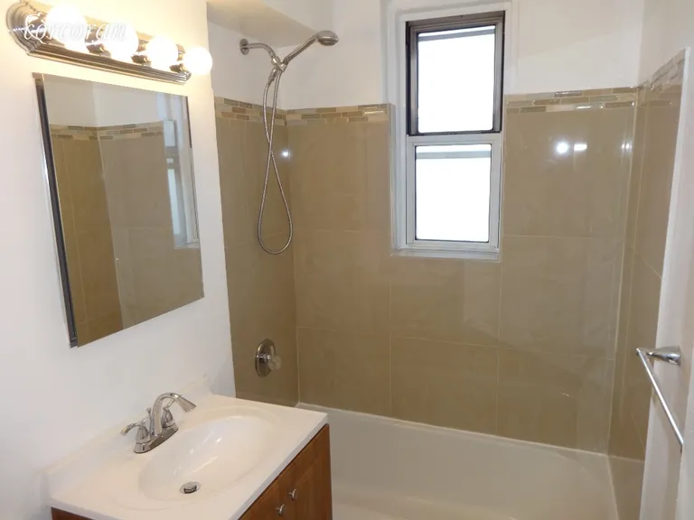 New York City Real Estate | View 2104 Holland Avenue, 5D | contemporary bath with window | View 6